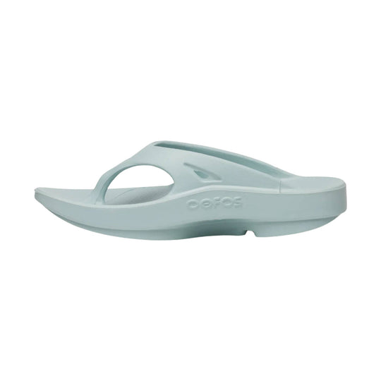 Light blue foam flip-flop sandal with a thick sculpted sole and toe loop