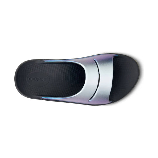 Black and iridescent slide sandal with a wide single strap and molded footbed