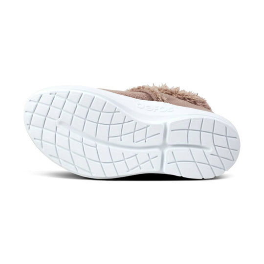 White foam shoe outsole with grid tread and beige sherpa upper