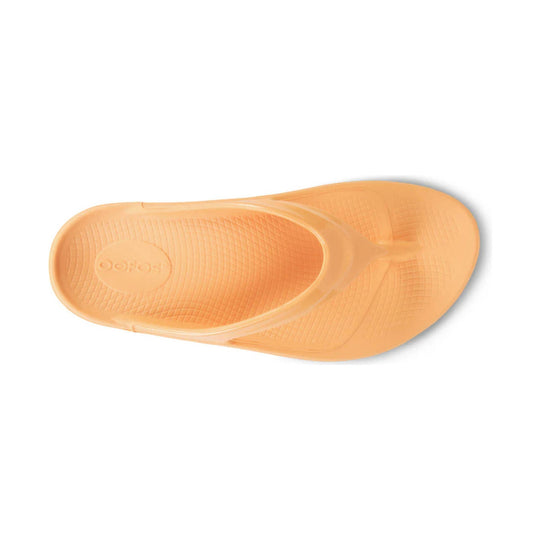 Peach-orange rubber sandal sole with textured tread and embossed Oofos logo