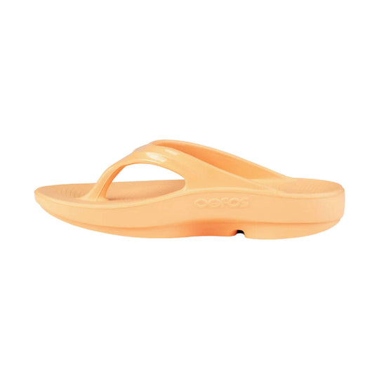 Orange thong slide sandal with a thick platform sole and embossed side logo