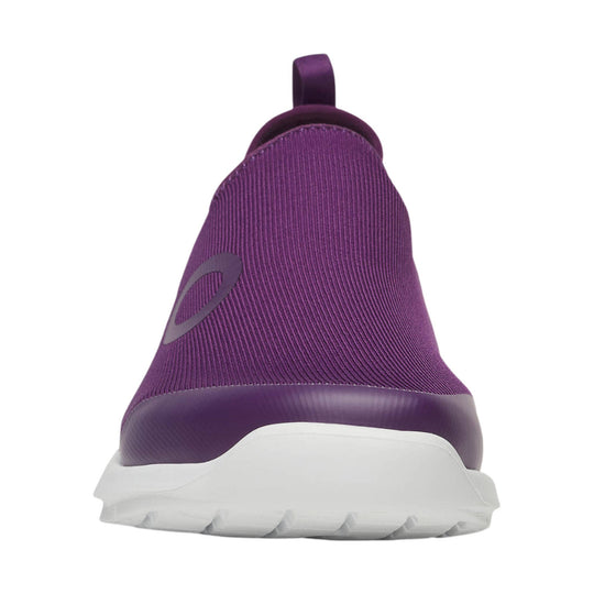 Purple slip-on athletic shoe with a white sole, rear view