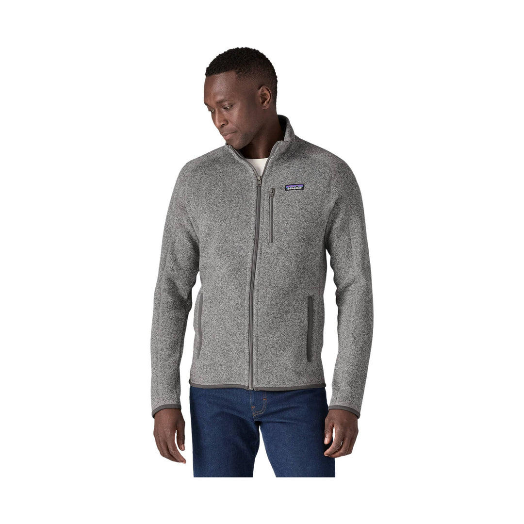 Gray full-zip fleece jacket with chest pocket and two hand pockets, worn over jeans