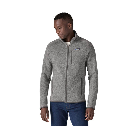 Gray full-zip fleece jacket with chest pocket and two hand pockets, worn over jeans