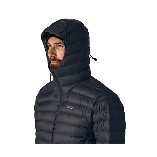 Black hooded puffer jacket with front zipper and small chest logo patch