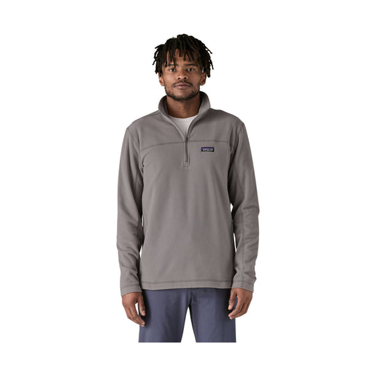 Gray quarter-zip fleece pullover with a stand collar and small chest logo