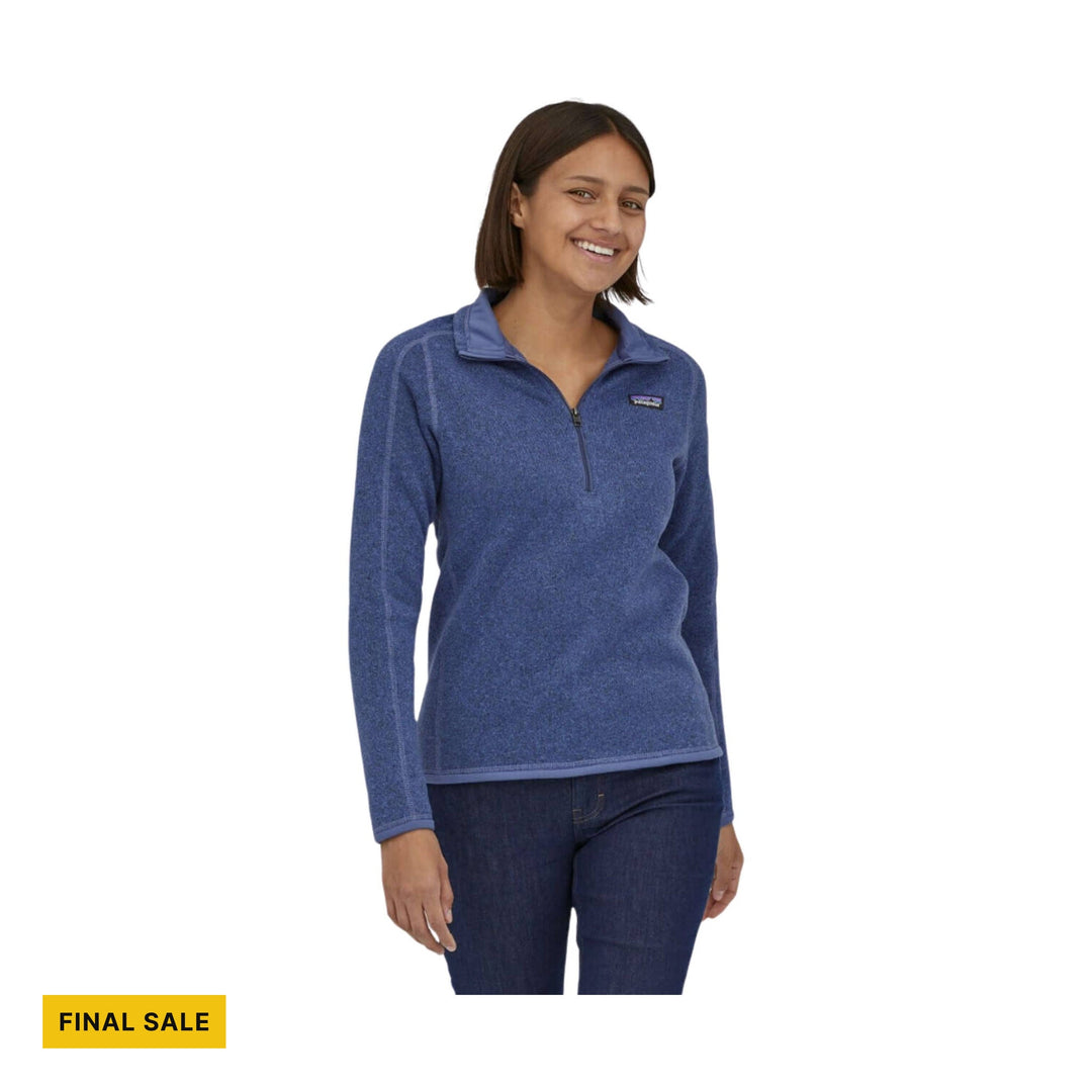 Blue quarter-zip fleece pullover with long sleeves and a small chest logo, shown on a model