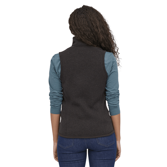 Dark charcoal fleece vest layered over a blue long-sleeve shirt, shown from the back