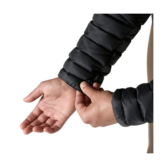 Black puffer jacket sleeve being adjusted at the cuff