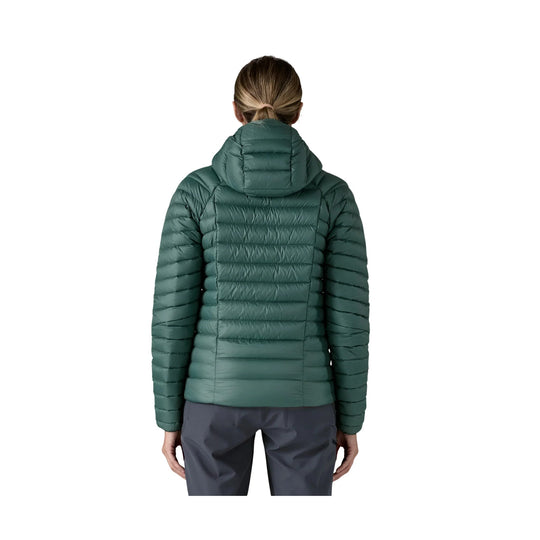 Green quilted hooded puffer jacket shown from the back