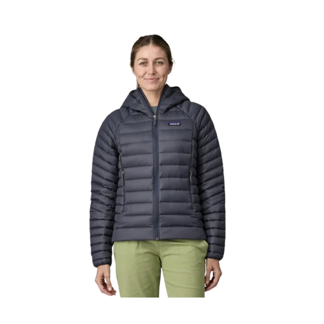 Dark gray quilted hooded puffer jacket with front zipper and chest logo patch