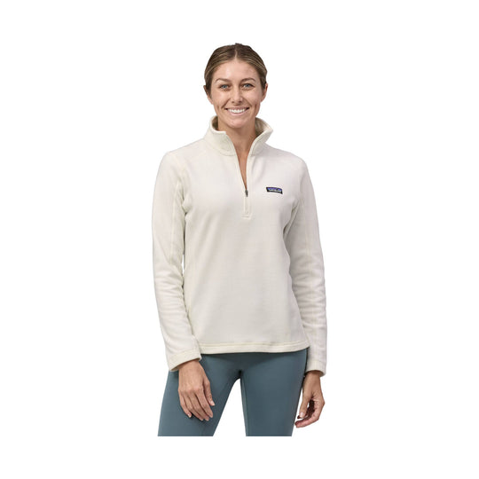 Cream quarter-zip fleece pullover with a stand collar and small chest logo, shown on a model.