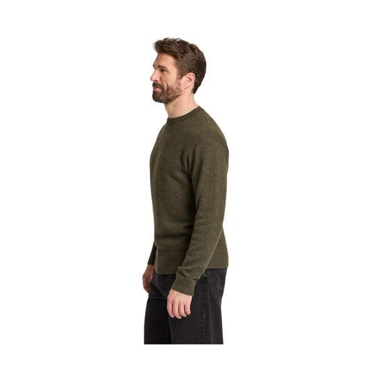 Olive crewneck sweater shown in side profile on a model