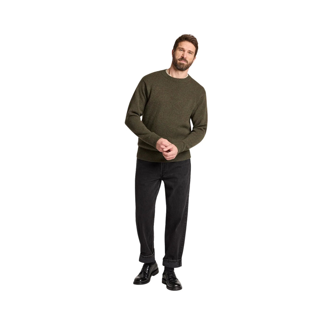Olive crewneck sweater with long sleeves, shown with black cuffed pants and black shoes