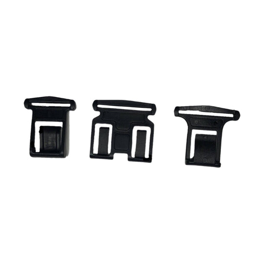 Three black plastic suspender clips on a white background