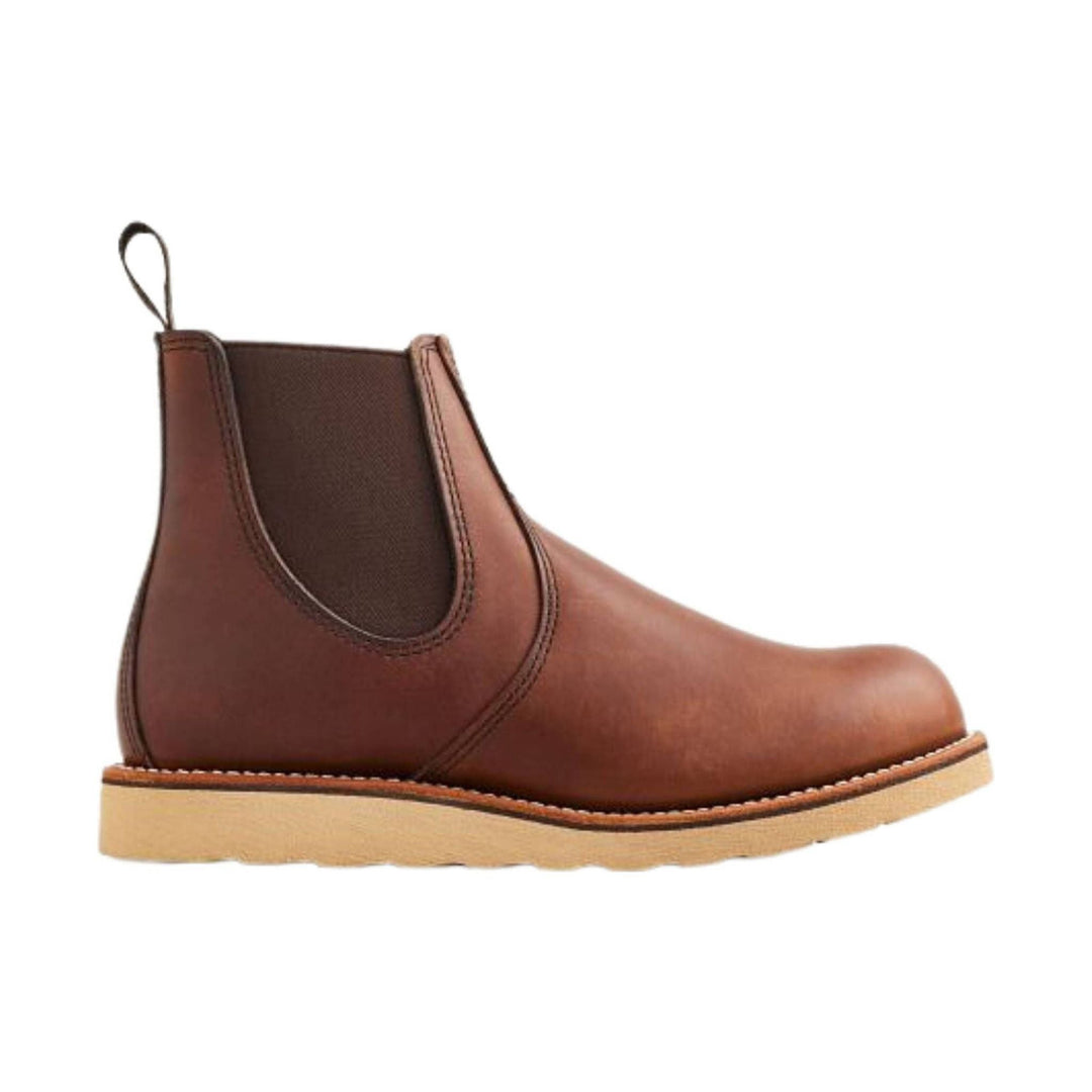 Brown leather Chelsea boot with elastic side panel, pull tab, and tan lug sole
