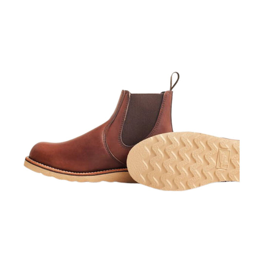 Brown Chelsea boot with elastic side panels and a light-colored lug sole