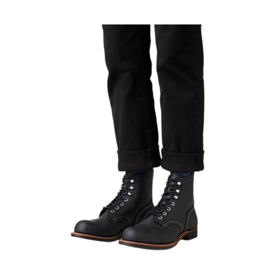 Black lace-up leather boots with rounded toes and a low heel