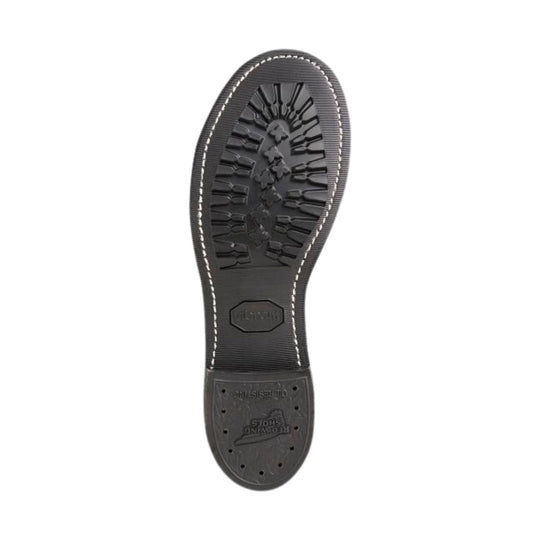 Black boot outsole with deep tread, white welt stitching, and embossed logo text