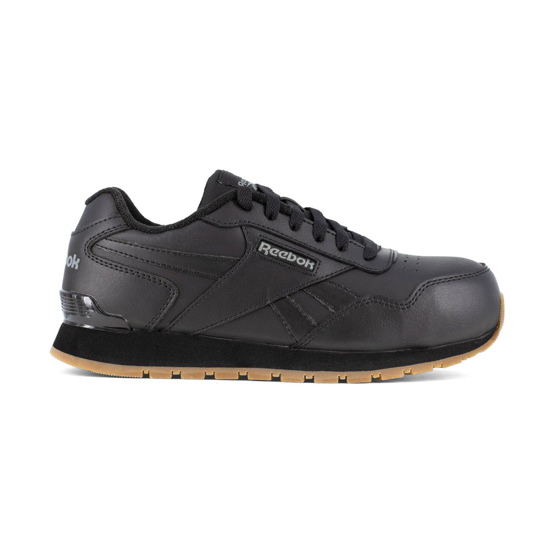 Black low-top work shoe with laces and gum sole, shown in side view