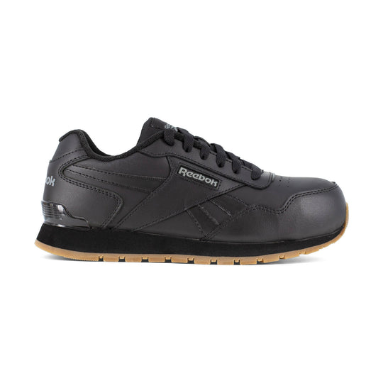 Black low-top work shoe with laces and gum sole, shown in side view