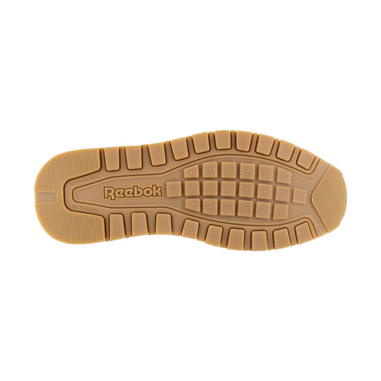 Tan slip-resistant shoe outsole with Reebok branding and tread pattern
