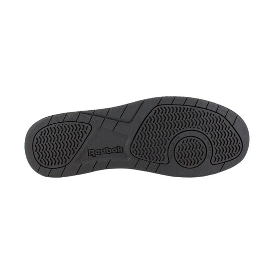 Black work shoe outsole with Reebok logo and oil-resisting tread pattern