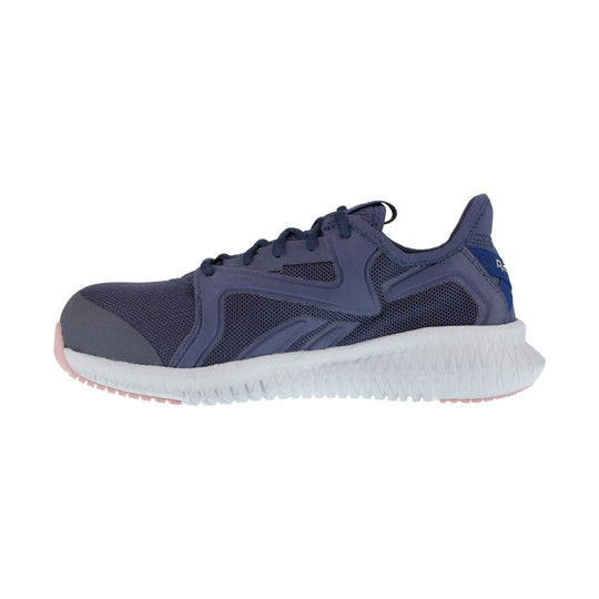 Navy athletic work shoe with a white textured sole and pink outsole accents, shown in side view