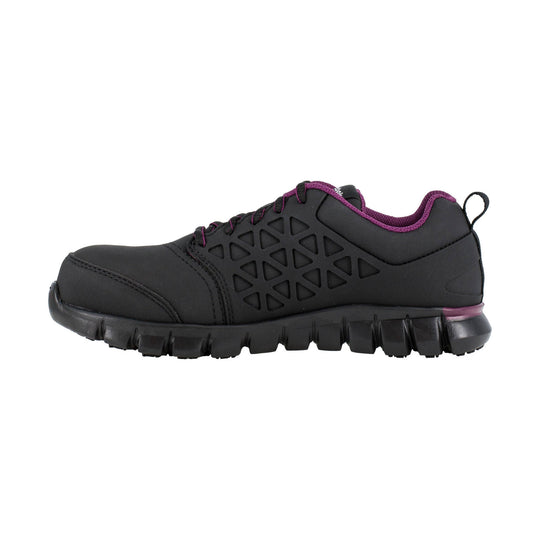 Black athletic work shoe with purple trim and a thick lug sole, shown in side view