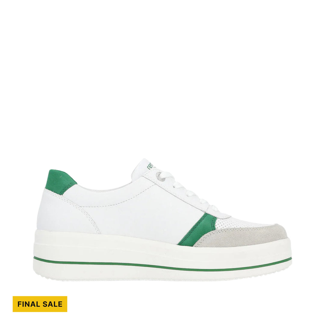 White platform sneaker with green heel and toe accents, shown in side view