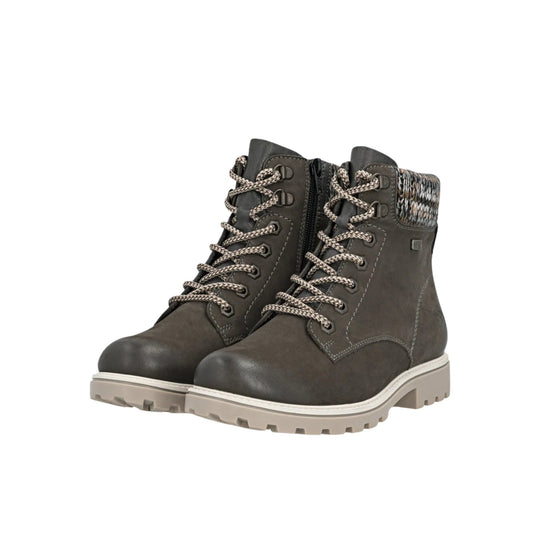 Pair of dark brown ankle boots with braided laces, side zippers, and light beige lug soles
