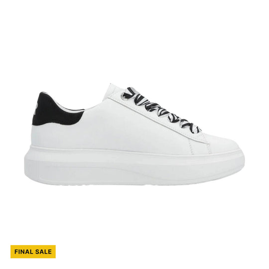 White low-top platform sneaker with black heel detail and black-and-white striped laces, shown in side view