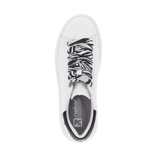 White low-top sneaker with black-and-white zebra-print laces and a gray insole