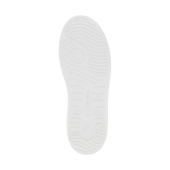 White shoe outsole with ridged tread and faint molded branding