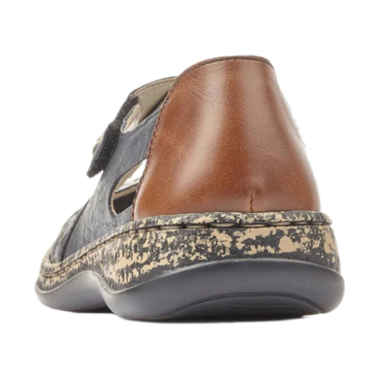 Brown and gray closed-toe sandal with side cutouts and a patterned sole