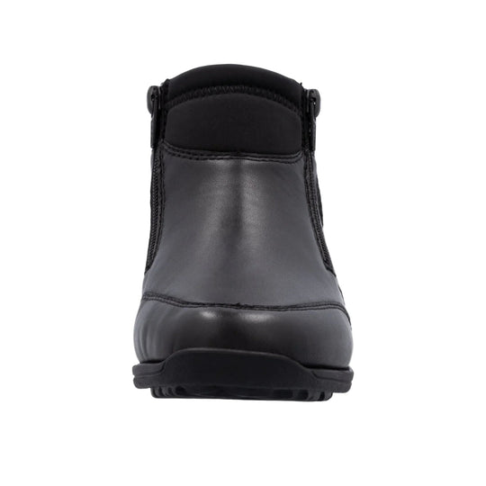 Black ankle boot with zipper closures, padded collar, and thick rubber sole, front view