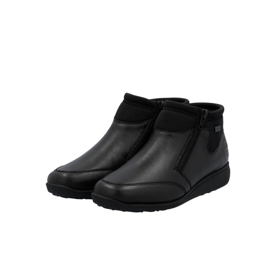 Pair of black ankle boots with side zippers and wedge soles