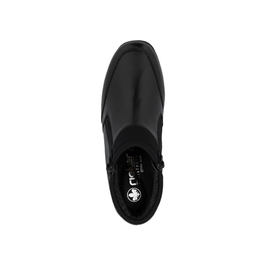 Black ankle boot viewed from above with a rounded toe, side zipper, and branded insole