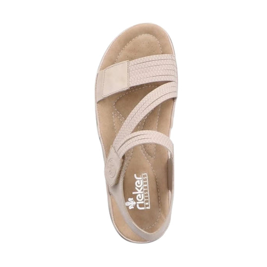 Beige women’s sandal with crisscross straps and an open toe