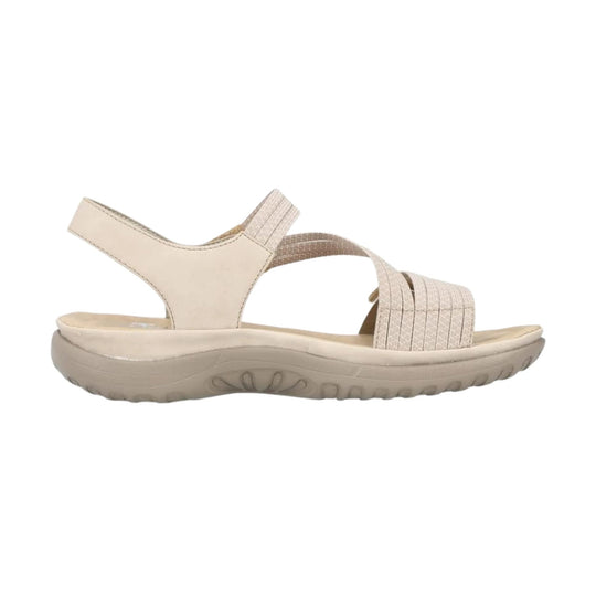 Beige women’s wedge sandal with crossed straps and an adjustable heel strap