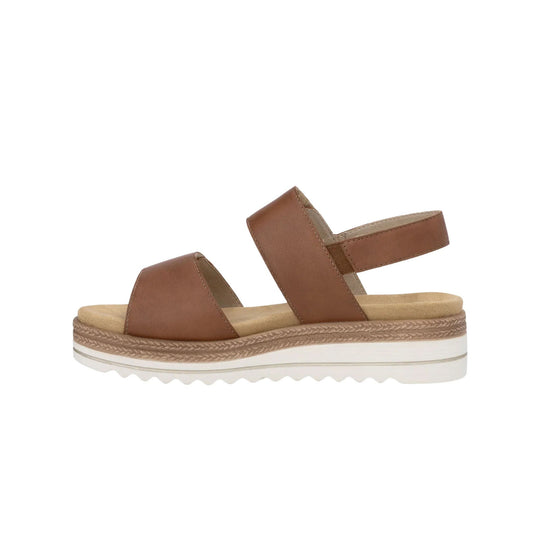 Brown women’s platform sandal with wide straps and a white treaded sole