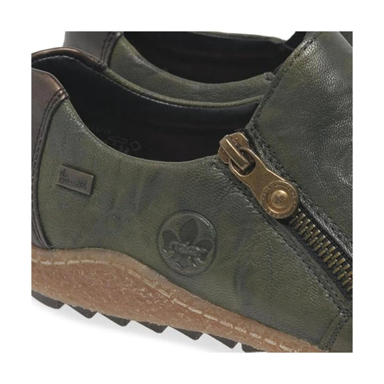 Olive green leather slip-on shoe with side zipper, tan sole, and Rieker plaque