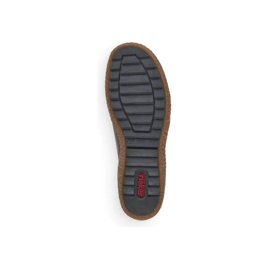 Shoe sole with black tread and brown welt, showing a Rieker logo near the heel