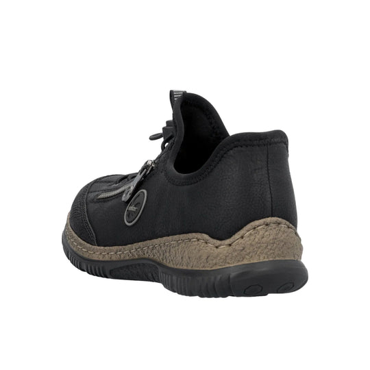 Black low-top shoe with side zipper, stitched tan sole, and pull tab