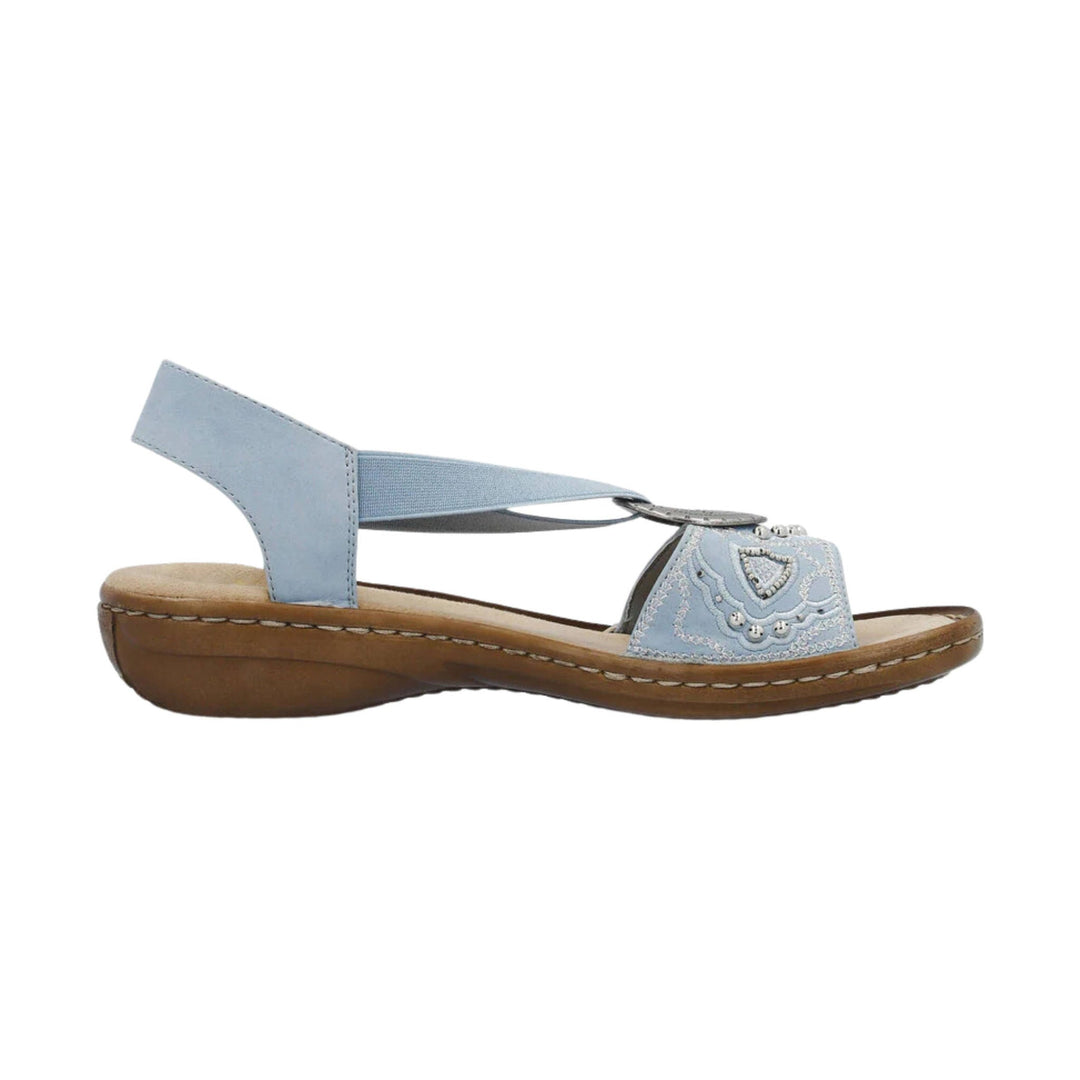 Light blue slingback sandal with a low wedge heel and decorative toe strap