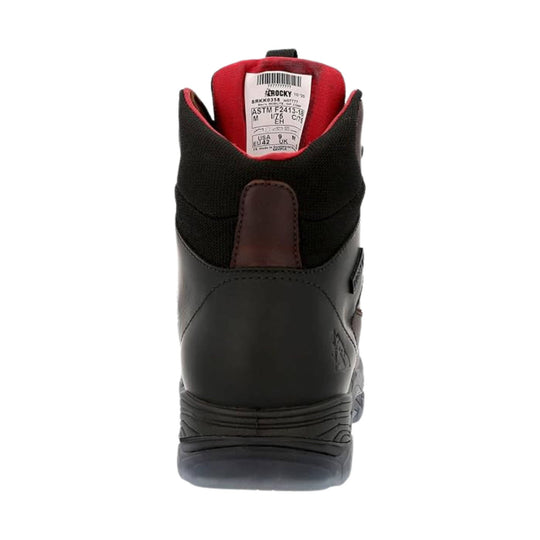 Black work boot with red lining, rear pull tab, and visible compliance label inside the collar