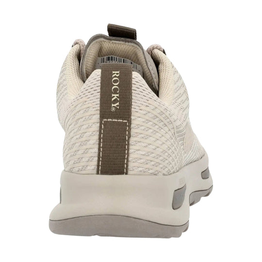 Rear view of a beige knit sneaker with a brown pull tab, thick white sole, and ROCKY on the heel tab