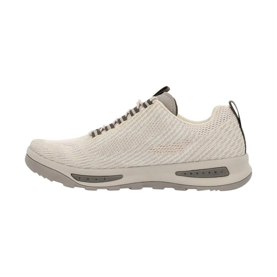 Light beige mesh athletic shoe with striped laces and a chunky gray sole, side view