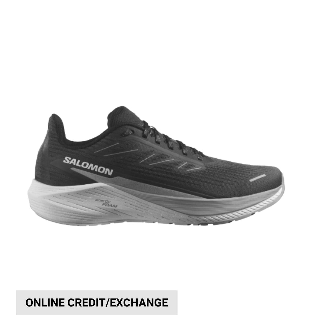 Black and gray running shoe in side profile with white midsole and visible SALOMON logo