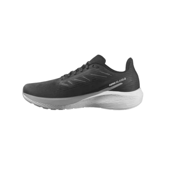 Black low-top running shoe with white cushioned sole, shown in side view